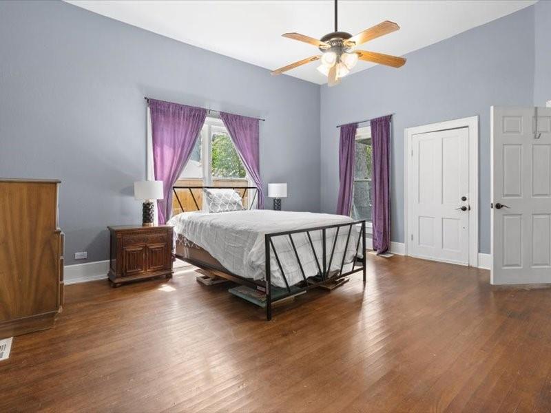 809 East Adams Street Itasca, TX 76055 - Photo 16 of 31 a bed room with a bed and a window