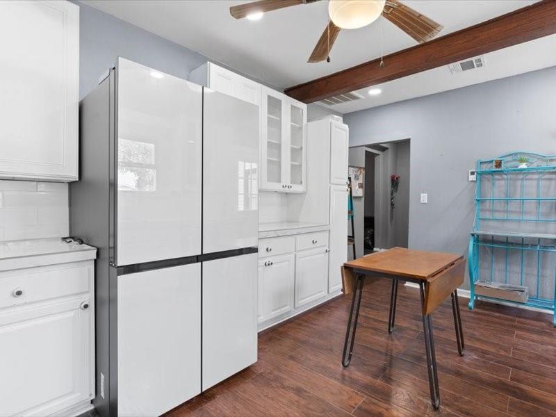 809 East Adams Street Itasca, TX 76055 - Photo 24 of 31 a kitchen with stainless steel appliances granite countertop a refrigerator a sink and a stove