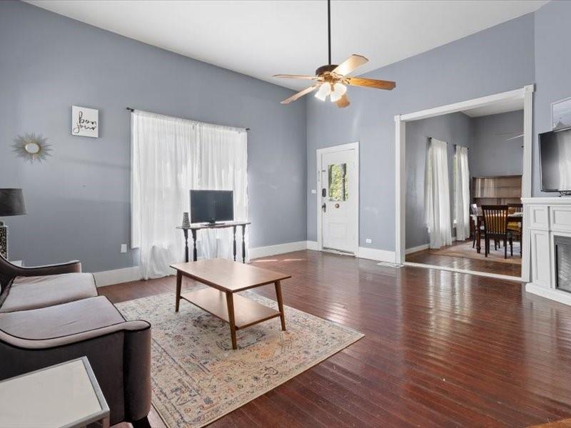 809 East Adams Street Itasca, TX 76055 - Photo 4 of 31 a living room with furniture and a wooden floor