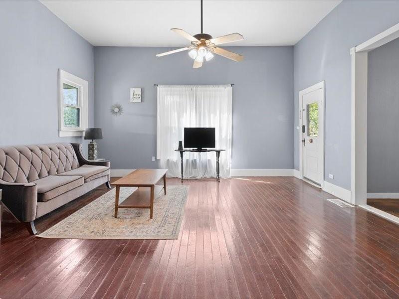 809 East Adams Street Itasca, TX 76055 - Photo 5 of 31 a living room with furniture and a fireplace