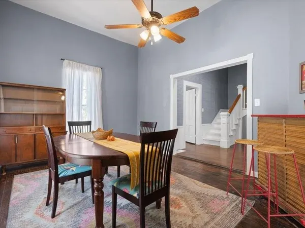 a dining room with furniture and window