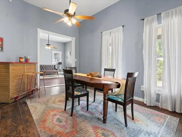 a dining room with furniture and window
