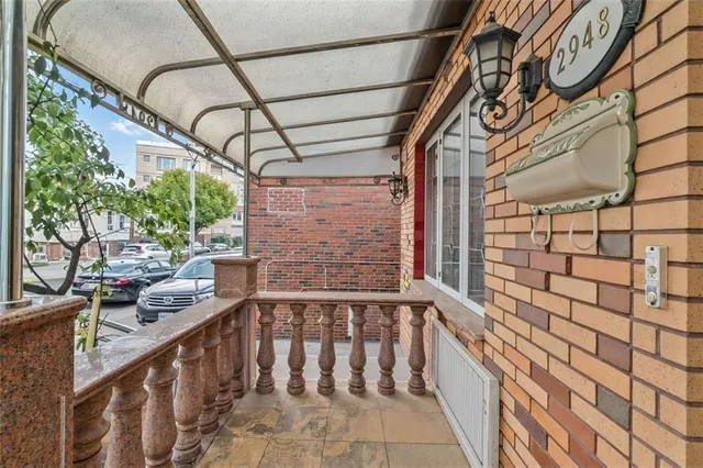 a view of a bedroom with a bed and a white cabinet