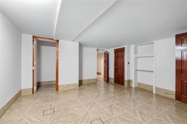 a kitchen with stainless steel appliances a refrigerator and a stove top oven