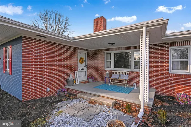 a front view of a house with a barbeque