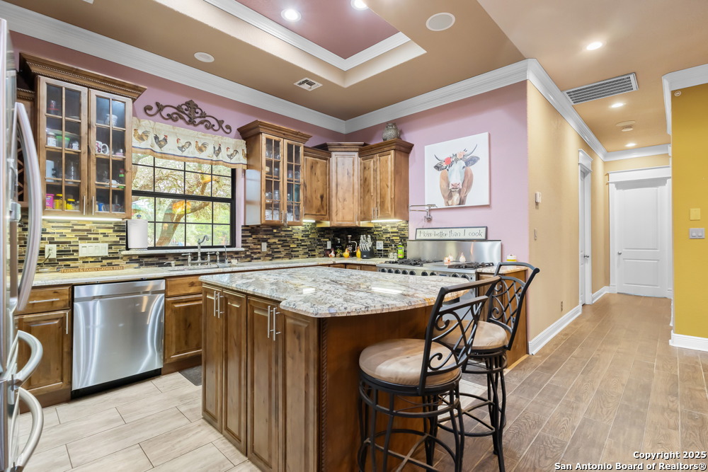168 Bandera Boulevard Bandera, TX 78003 - Photo 12 of 39 a kitchen with granite countertop lots of counter top space and dining table