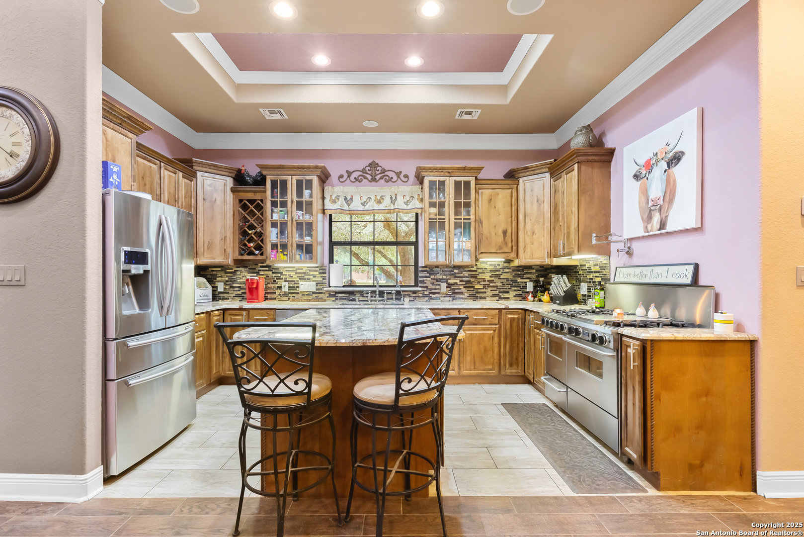 168 Bandera Boulevard Bandera, TX 78003 - Photo 13 of 39 a kitchen with stainless steel appliances granite countertop a table chairs cabinets and sink