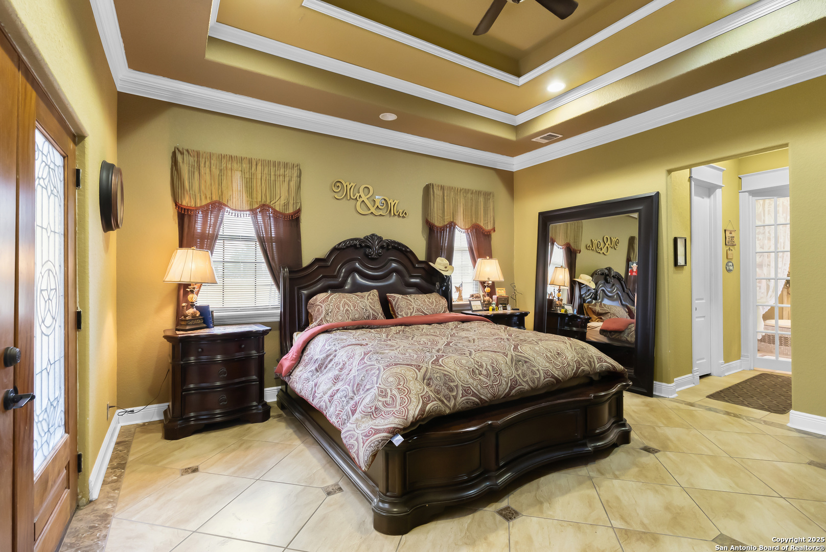 168 Bandera Boulevard Bandera, TX 78003 - Photo 15 of 39 a bedroom with a bed and wooden floor