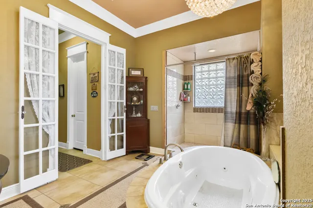 a bathroom with a tub and shower