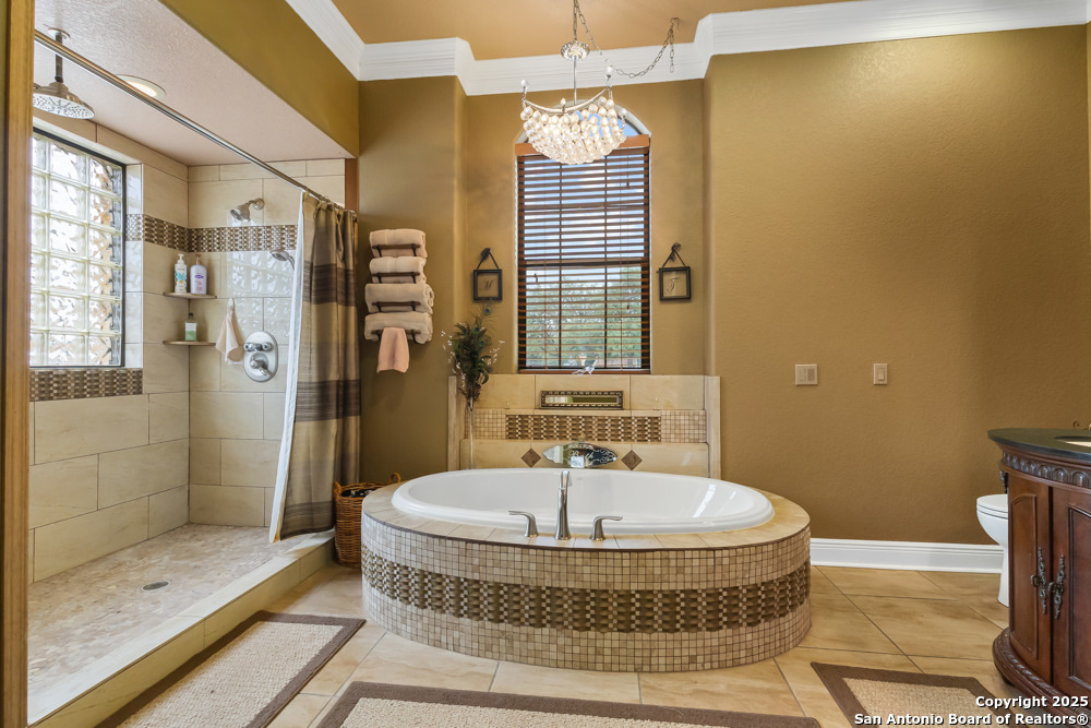 168 Bandera Boulevard Bandera, TX 78003 - Photo 19 of 39 a bathroom with a tub and shower