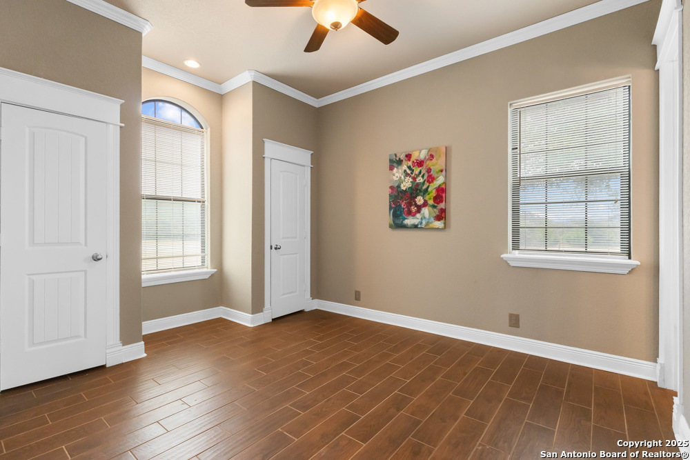 168 Bandera Boulevard Bandera, TX 78003 - Photo 21 of 39 wooden floor in an empty room with a window