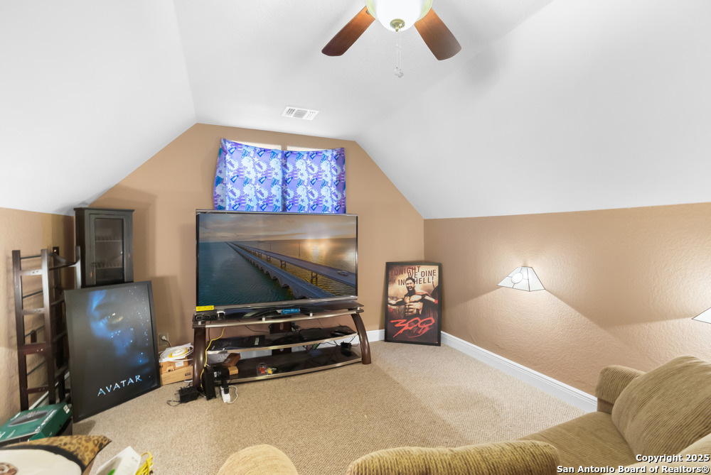 168 Bandera Boulevard Bandera, TX 78003 - Photo 26 of 39 a living room with furniture and a flat screen tv