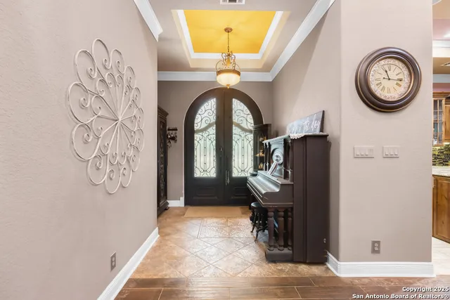 a view of entryway with a grandfather clock and a table