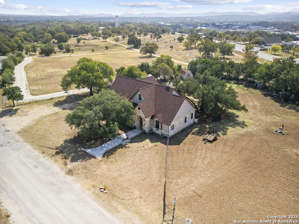 168 Bandera Boulevard Bandera, TX 78003 - Photo 29 of 39 an aerial view of a house with a yard and mountain