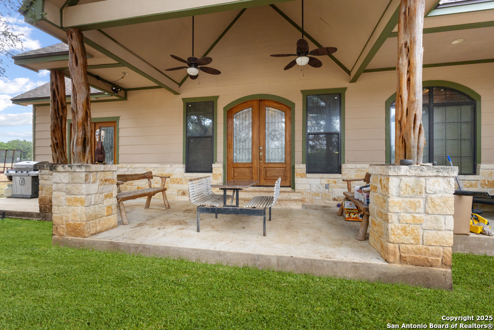 168 Bandera Boulevard Bandera, TX 78003 - Photo 3 of 39 a group of people sitting in a yard