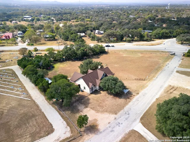 an aerial view of residential houses with outdoor space