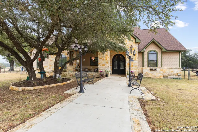 a front view of a house with garden