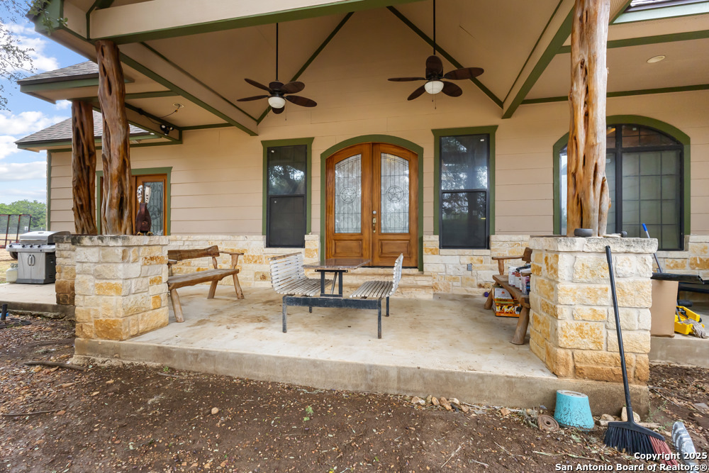 168 Bandera Boulevard Bandera, TX 78003 - Photo 38 of 39 a living room with fireplace furniture and a potted plant