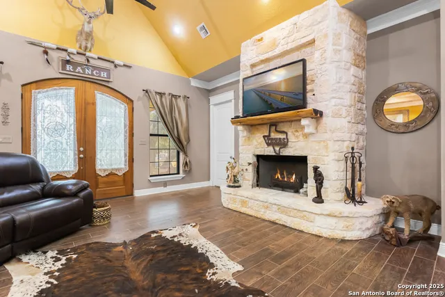 a living room with furniture and a fireplace