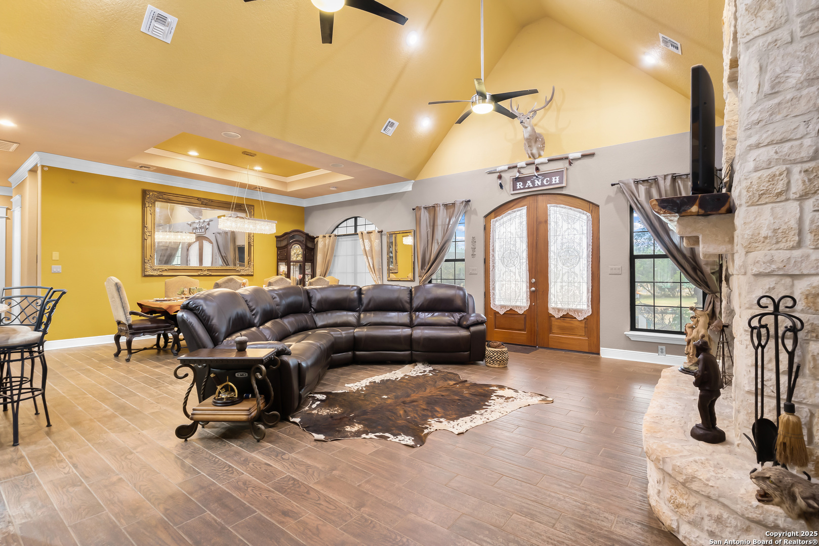 168 Bandera Boulevard Bandera, TX 78003 - Photo 9 of 39 a living room with lots of furniture and a chandelier