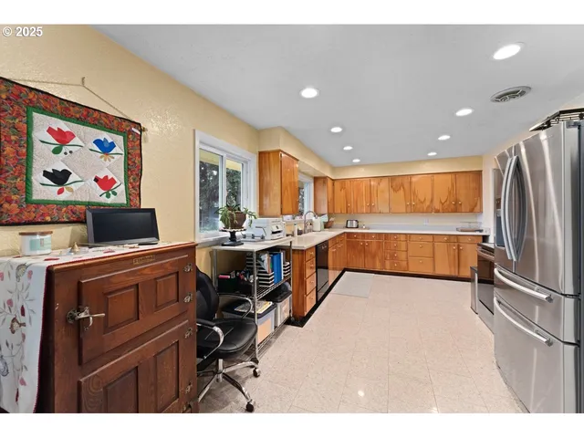 a view of kitchen with furniture and flat screen tv