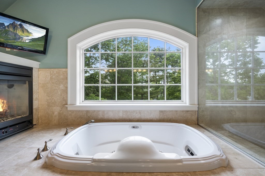 49 Harbor Avenue Marblehead, MA 01945 - Photo 36 of 42 a bath tub sitting in a bathroom next to a window