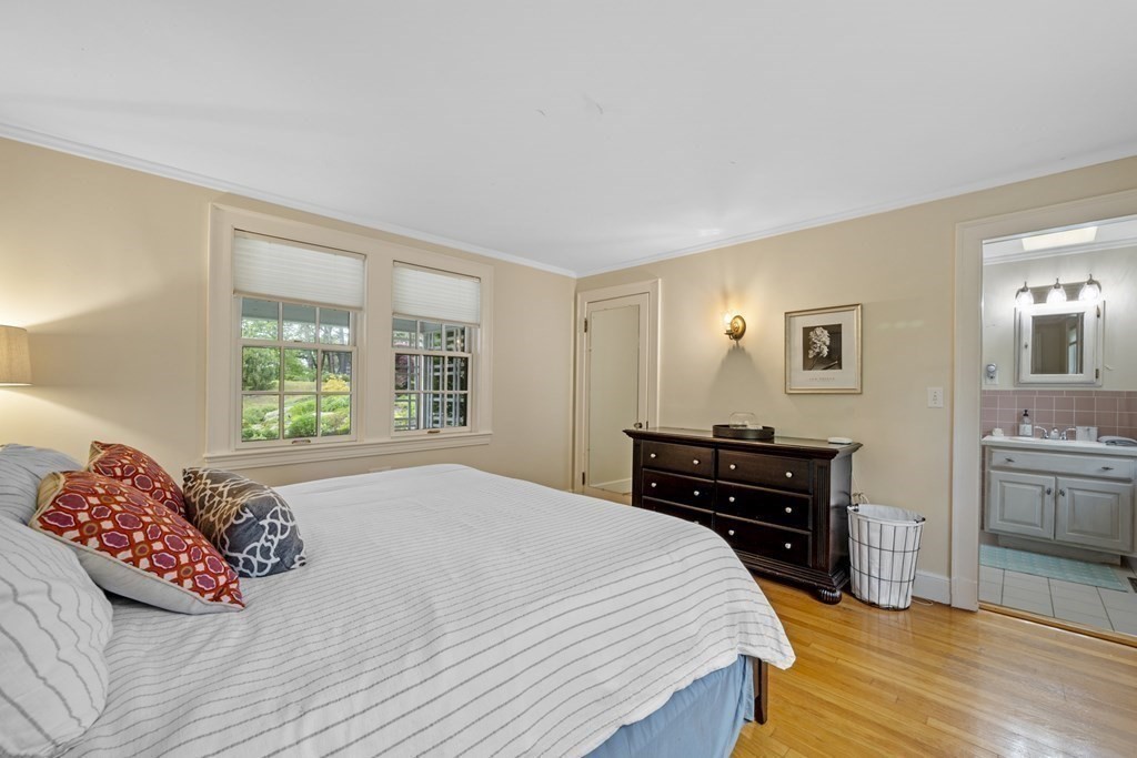 49 Harbor Avenue Marblehead, MA 01945 - Photo 42 of 42 a bedroom with a bed and wooden floor