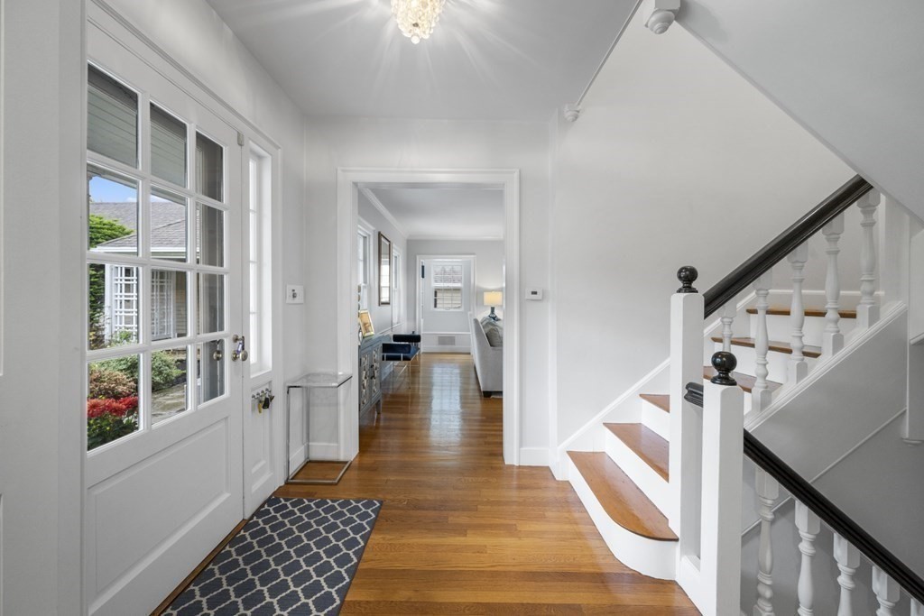 49 Harbor Avenue Marblehead, MA 01945 - Photo 8 of 42 a hallway with white cabinets and wooden floor