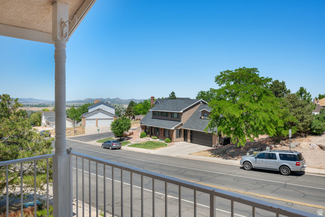 790 East Fiddlers Canyon Road Cedar City, UT 84721 - Photo 3 of 35 Balcony with white spindle railing overlooking a residential street