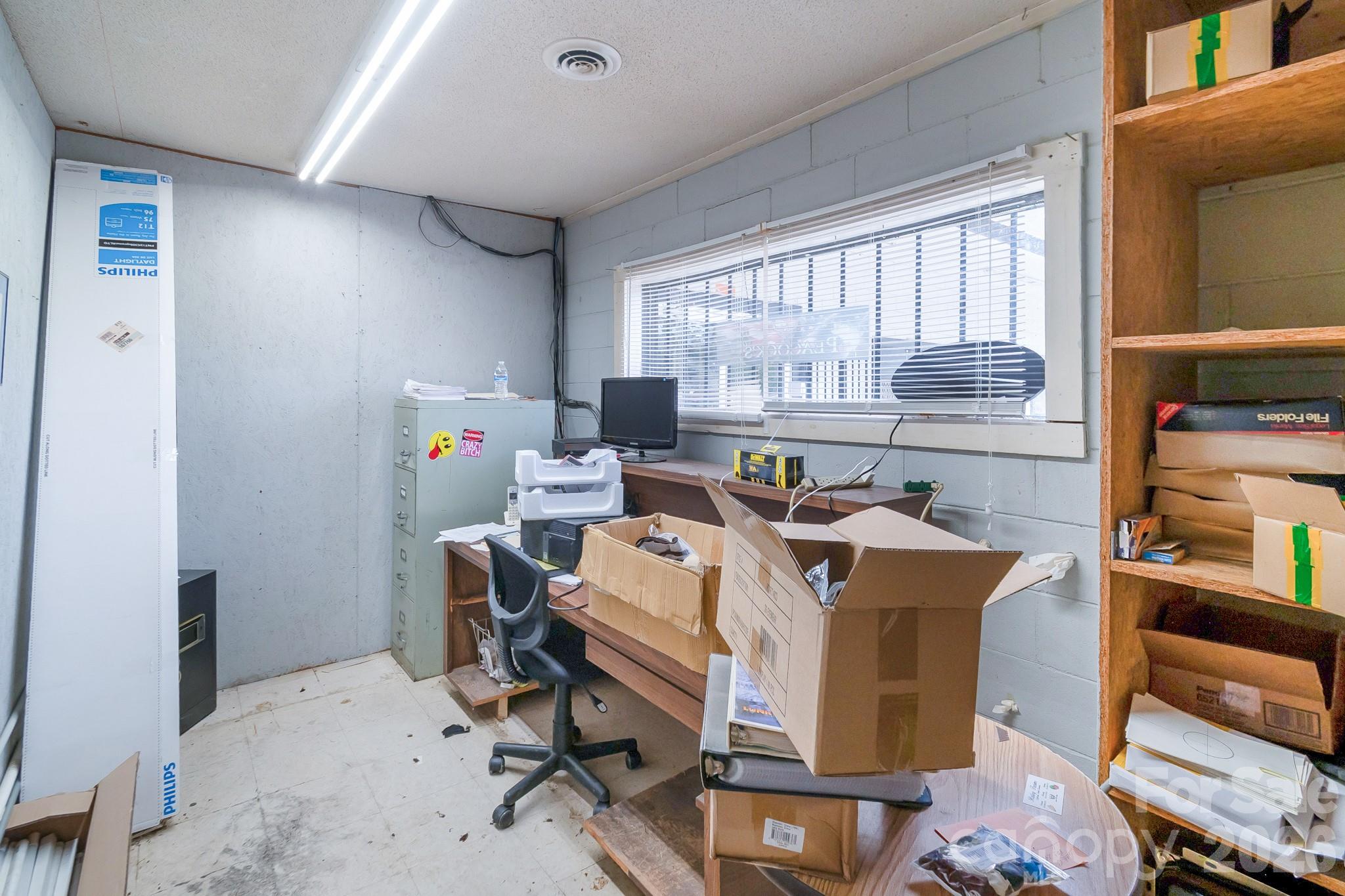 5400 Cedar Creek Road Liberty Hill, SC 29074 - Photo 14 of 48 a view of a workspace with furniture and a window