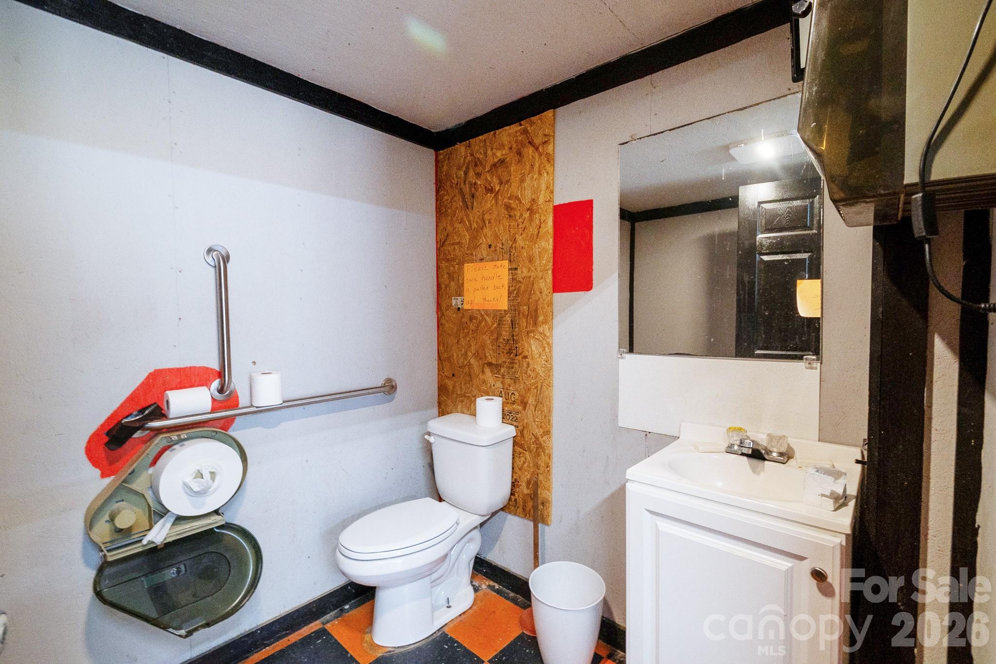 5400 Cedar Creek Road Liberty Hill, SC 29074 - Photo 18 of 48 a bathroom with a toilet sink vanity and mirror