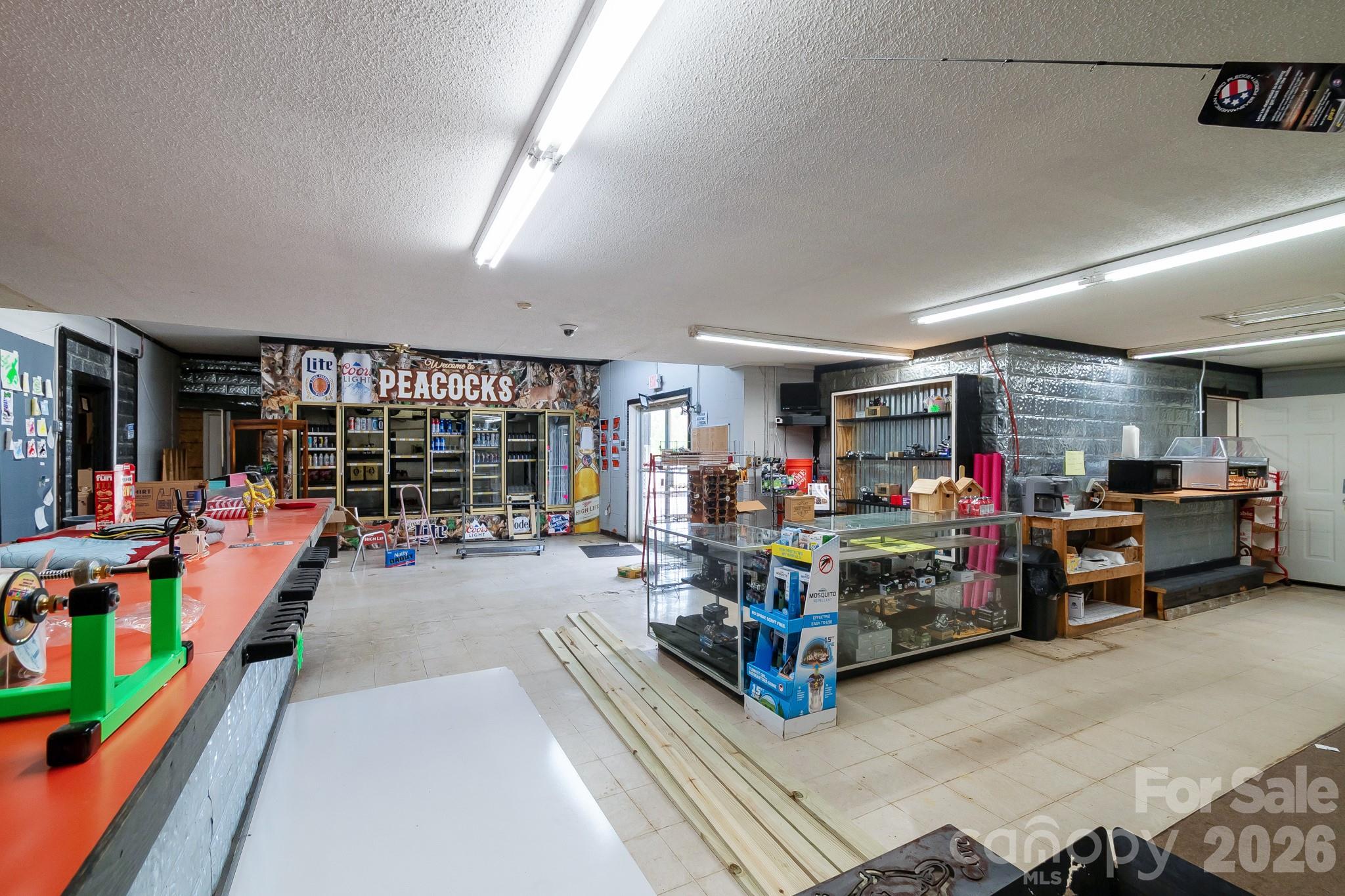 5400 Cedar Creek Road Liberty Hill, SC 29074 - Photo 26 of 48 a room with lots of wooden furniture and a large window