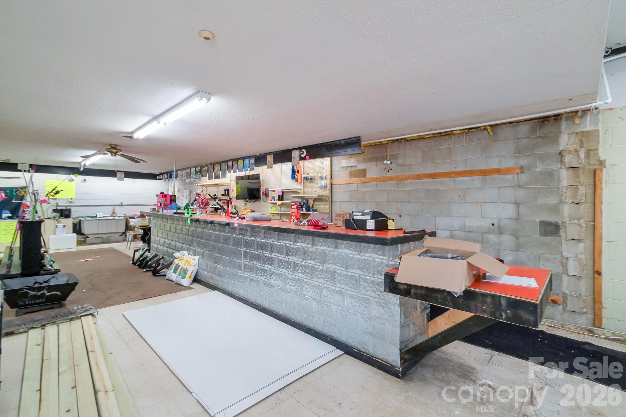 5400 Cedar Creek Road Liberty Hill, SC 29074 - Photo 4 of 48 a room with lots of wooden furniture and a mirror