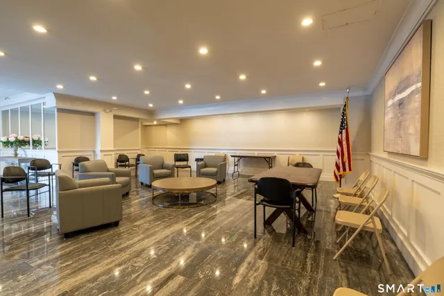 a living room with lots of furniture and a rug