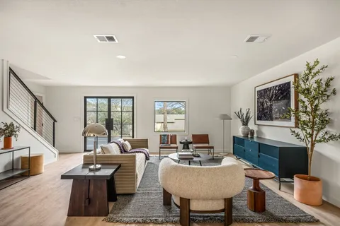 a living room with furniture and a table