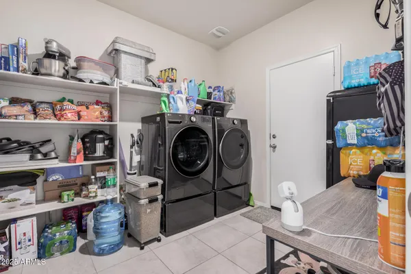 a room with wine cabinets and a book shelf