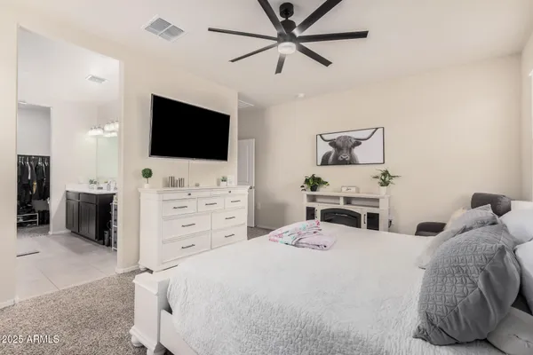 a utility room with fridge dryer and washer