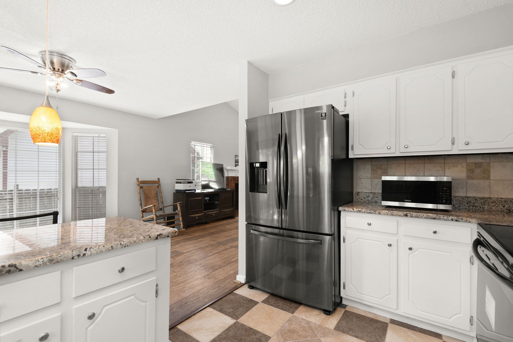 305 Cedarcliff Road Antioch, TN 37013 - Photo 15 of 32 a kitchen with granite countertop a refrigerator and a sink