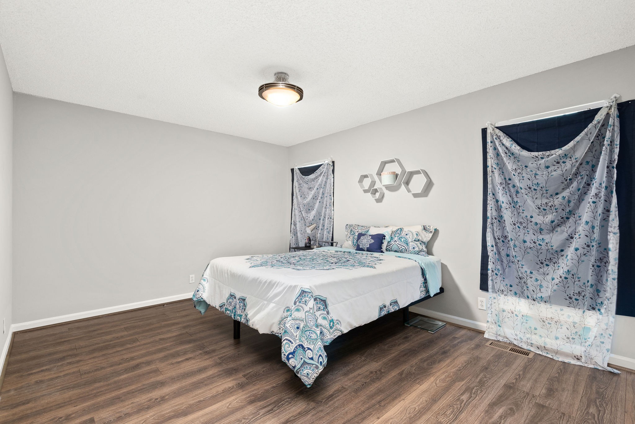 305 Cedarcliff Road Antioch, TN 37013 - Photo 16 of 32 a bedroom with a bed and wooden floor