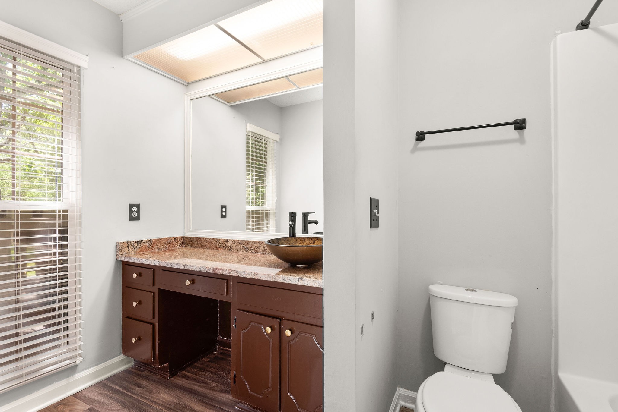 305 Cedarcliff Road Antioch, TN 37013 - Photo 18 of 32 a bathroom with a granite countertop sink and a toilet