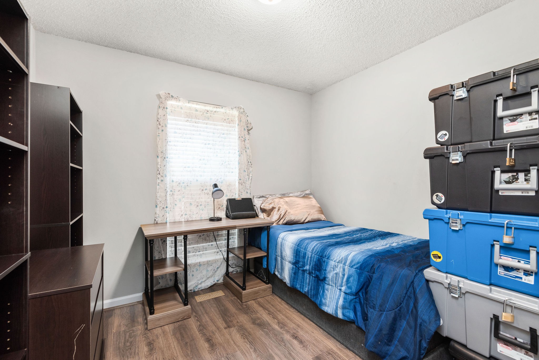 305 Cedarcliff Road Antioch, TN 37013 - Photo 22 of 32 a bedroom with a bed and a tv on a dresser