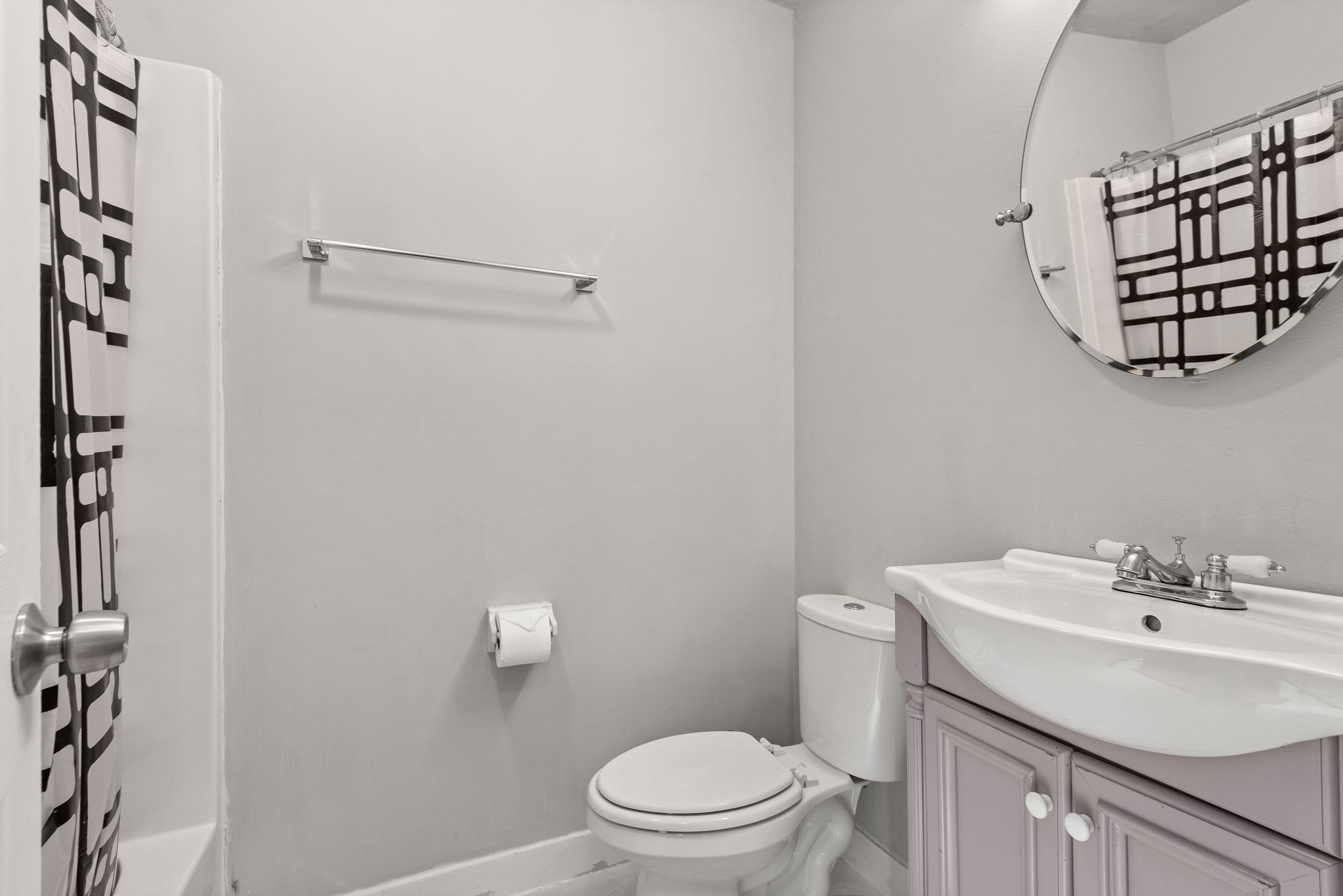305 Cedarcliff Road Antioch, TN 37013 - Photo 23 of 32 a bathroom with a sink a toilet and a mirror