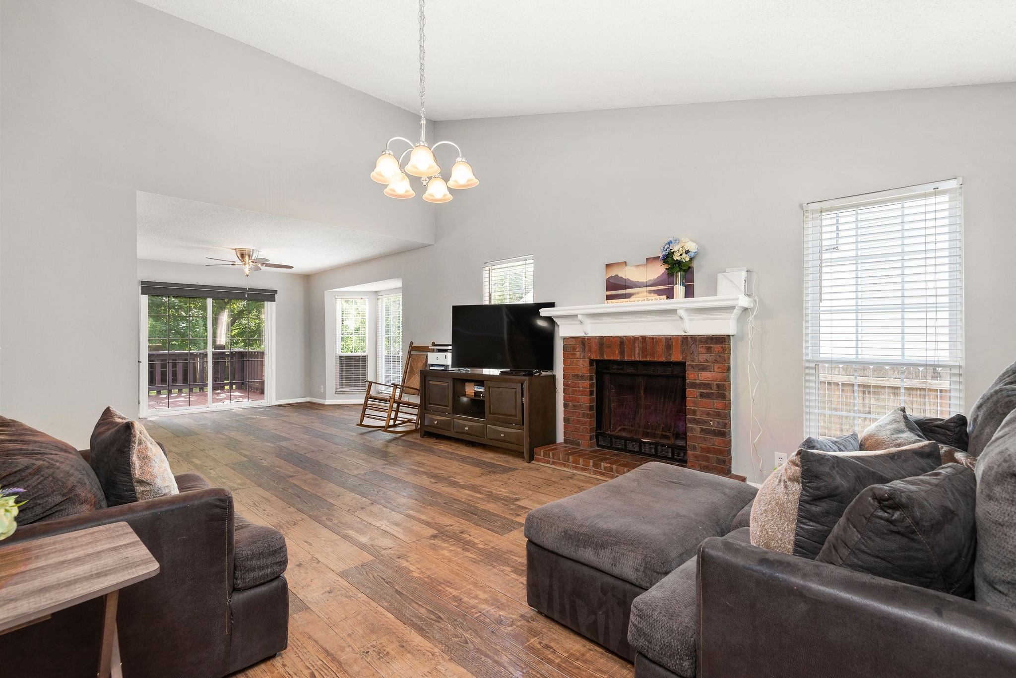 305 Cedarcliff Road Antioch, TN 37013 - Photo 5 of 32 a living room with furniture a fireplace and a flat screen tv