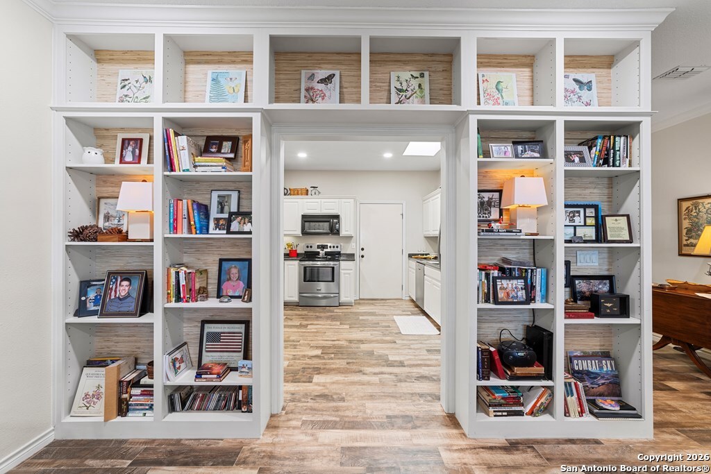 1008 Edinburgh Drive Kerrville, TX 78028 - Photo 11 of 24 a view of a workspace with bookshelf