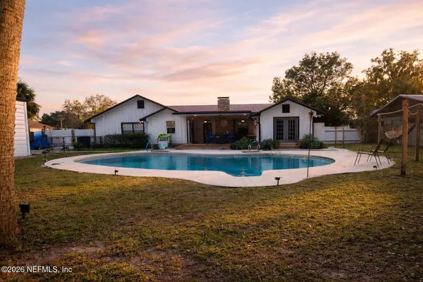 a view of a house with swimming pool