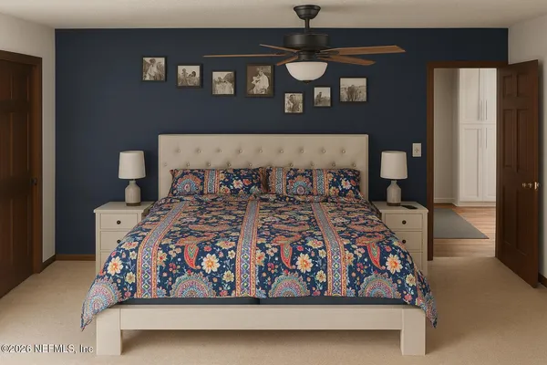 a bed sitting in a bedroom next to a window