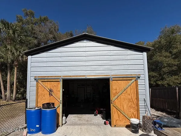 a view of a backyard of the house