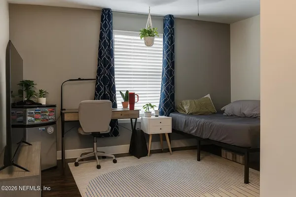 a living room with furniture rug and window