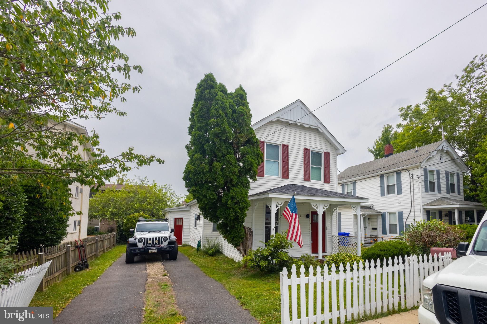 37 4th Street Laurel, MD 20707 - Photo 21 of 26 a front view of a house with a garden