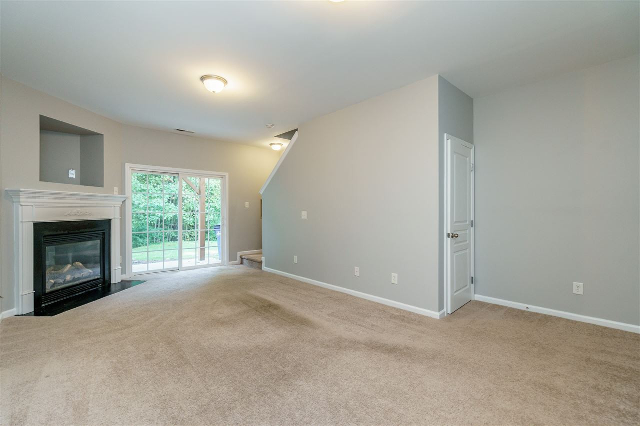 7675 Winners Edge Street Raleigh, NC 27617 - Photo 17 of 23 a view of an empty room with a window and fireplace